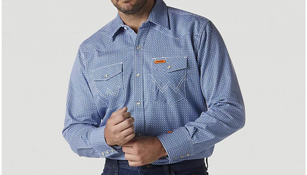 model wearing blue fire retardant button down shirt